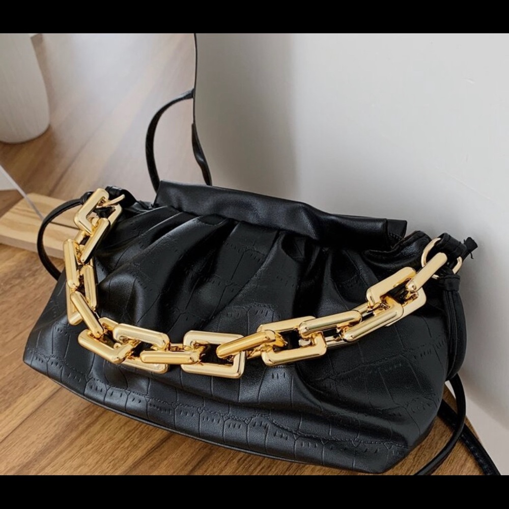 Black and gold purse. Brand new!